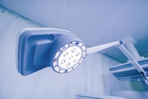 modern surgical lighting equipment lamps in operating room in clinic or hospital photo