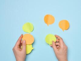 Paper stickers in the shape of a cloud in female hands photo