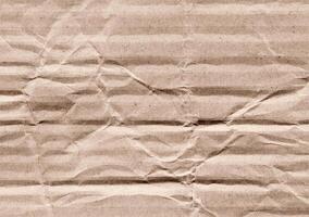 Crumpled brown kraft paper texture banner background photo