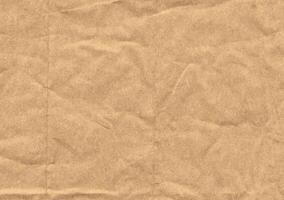 Crumpled brown kraft paper texture banner background photo