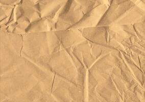 Crumpled brown kraft paper texture banner background photo