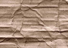 Crumpled brown kraft paper texture banner background photo