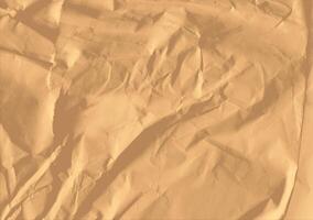 Crumpled brown kraft paper texture banner background photo