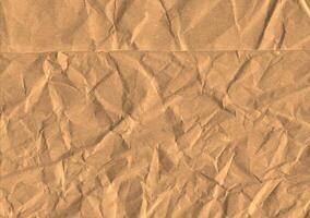 Crumpled brown kraft paper texture banner background photo