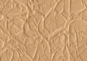 Crumpled brown kraft paper texture banner background photo