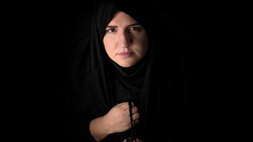 Religious muslim woman in prayer outfit photo