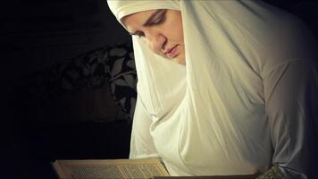 Religious muslim woman in prayer outfit photo