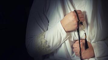 Religious muslim woman in prayer outfit photo