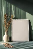 AI generated blank canvas frame template with dry flowers in vase on olive green wall mockup photo