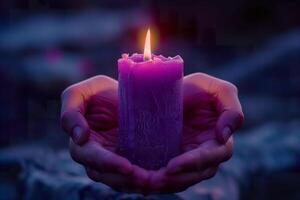 AI generated Close-up of a person's hands gently holding a lit purple candle. Generative AI. photo