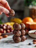 AI generated A hand placing carefully crafted energy balls made with almonds, oats, and seeds, dusted with coconut flakes. Generative AI. photo