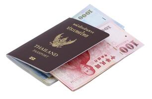 Thai passport with Taiwan Dollars banknotes isolated on white background. photo