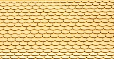 Yellow ceramic tiled roof pattern. photo