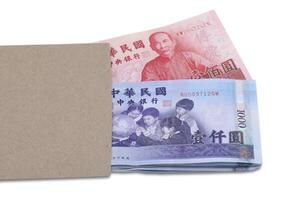 Taiwan dollar in brown envelope isolated on white background photo