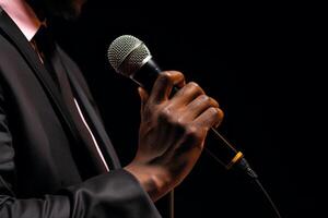 AI generated close up of hand holding microphone bokeh style background with generative ai photo