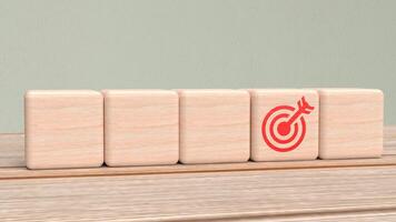 The target icon on wood cube for Business concept 3d Rendering photo