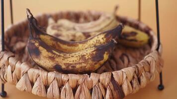 comparing rotten banana with a ripe banana on a white background video