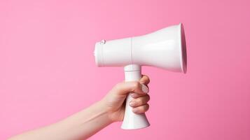 AI generated Female hand holding a white megaphone on a pink background. photo