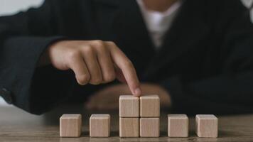 Blank wooden cubes on the table with copy space, empty wooden cubes for input wording, and an infographic icon photo