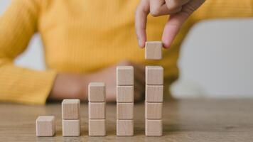 Blank wooden cubes on the table with copy space, empty wooden cubes for input wording, and an infographic icon photo