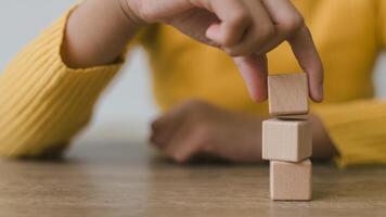 Blank wooden cubes on the table with copy space, empty wooden cubes for input wording, and an infographic icon photo