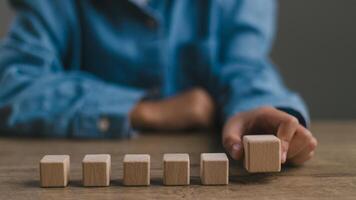 Blank wooden cubes on the table with copy space, empty wooden cubes for input wording, and an infographic icon. photo