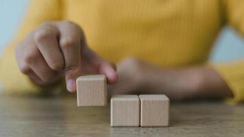 Blank wooden cubes on the table with copy space, empty wooden cubes for input wording, and an infographic icon photo