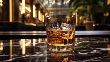 AI generated Glass of whiskey with ice cubes on a glass table in a bar photo