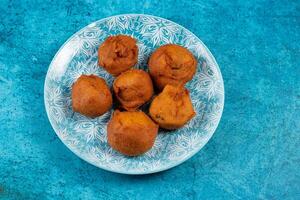 deep fried potato chop served in a dish isolated on table side view photo