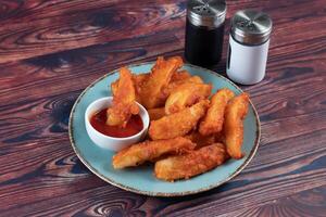 Potatos wedges with tomato sauce served in dish isolated on background side view of fastfood photo