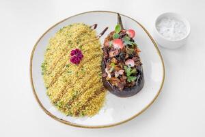 Moroccan Aubergine food served in a dish isolated on grey background top view photo