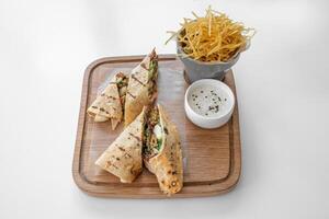 Apple Falafel Wrap with mayo dip served in a dish isolated on grey background top view photo