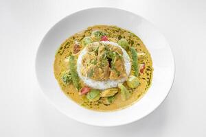 Thai Curry served in a dish isolated on grey background side view photo