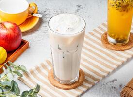 Iced Immortal grass iced milk tea on mat and white background. fresh Healthy drinks concept photo