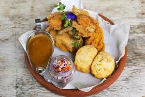 Beer Battered Fish and Chips served in a dish isolated on background top view of fastfood photo