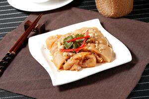 Sand Ginger Pork Knuckle in a dish isolated on grey background side view of Hong kong food photo