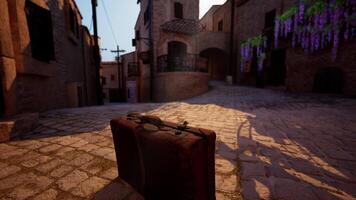 A suitcase sitting on a cobblestone street video