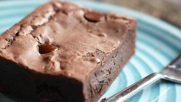 slice of brownie on plate on table video