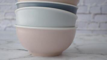 Colorful ceramic bowl on table video