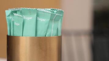 white sugar in a paper packet on table video