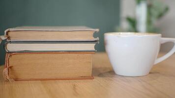 stack of books on wooden table video