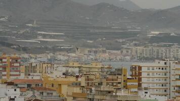 Military aircraft flying over buildings a cloudy day video