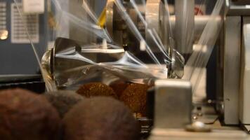 Trays of avocados in a packaging line video