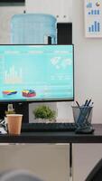 Vertical video Stock portfolio on trading platform displayed on computer containing collection of investment assets. Workplace with live index indices and pie charts on PC screen showing stock demand surge
