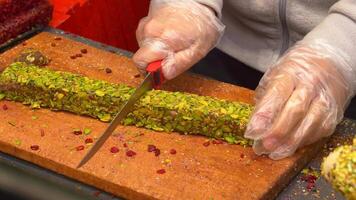 cutting Turkish traditional sweet Turkish delight on a chopping board video