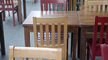 Wooden tables and chairs adorn the restaurants hardwood plank flooring video