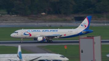 SOCHI, RUSSIA - AUGUST 02, 2022. Aircraft Airbus A320, RA-73828 of Ural Airlines slow down after landing at Sochi airport. Airplane arriving. Spoilers up. Tourism and travel concept video