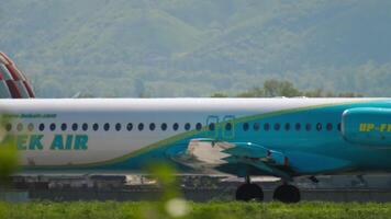 ALMATY, KAZAKHSTAN - MAY 5, 2019. Passenger aircraft Fokker 100, UP-F1005 of Bek Air takeoff, side view. Jet plane is accelerating, departing video