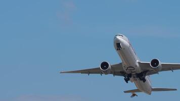 PHUKET, THAILAND - JANUARY 22, 2023. Boeing 777, A7-BAV Qatar Airways taking off at Phuket airport. Widebody heavy jet climbing. Footage of plane is flying overhead video