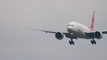 MOSCOW, RUSSIAN FEDERATION - JULY 29, 2021. Boeing 777, VP-BJF of Pegas Fly landing at Sheremetyevo airport. Landing gear touches the runway, braking, close-up video